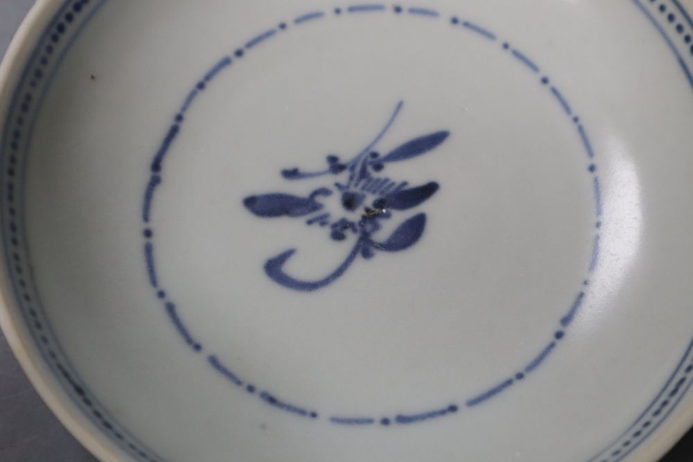 A Chinese Nanking Cargo Batavia tea bowl and saucer and Tek Sing Cargo blue and white tea bowl and saucer